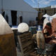Outside a tent, with large ornamental quartz, soaking up the Arizona sun.